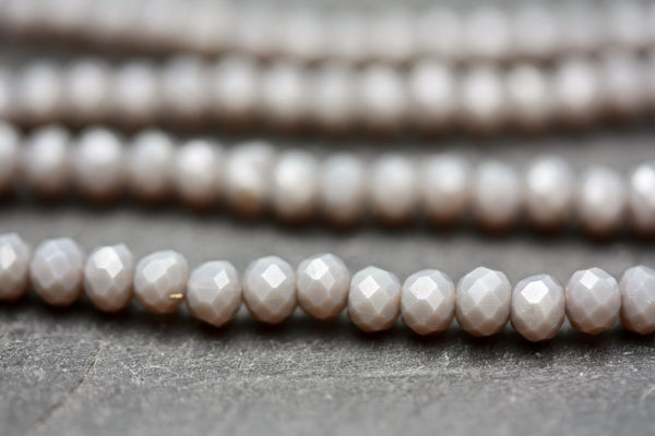 String of 3 x 4 mm opaque grey faceted glass rondel beads.