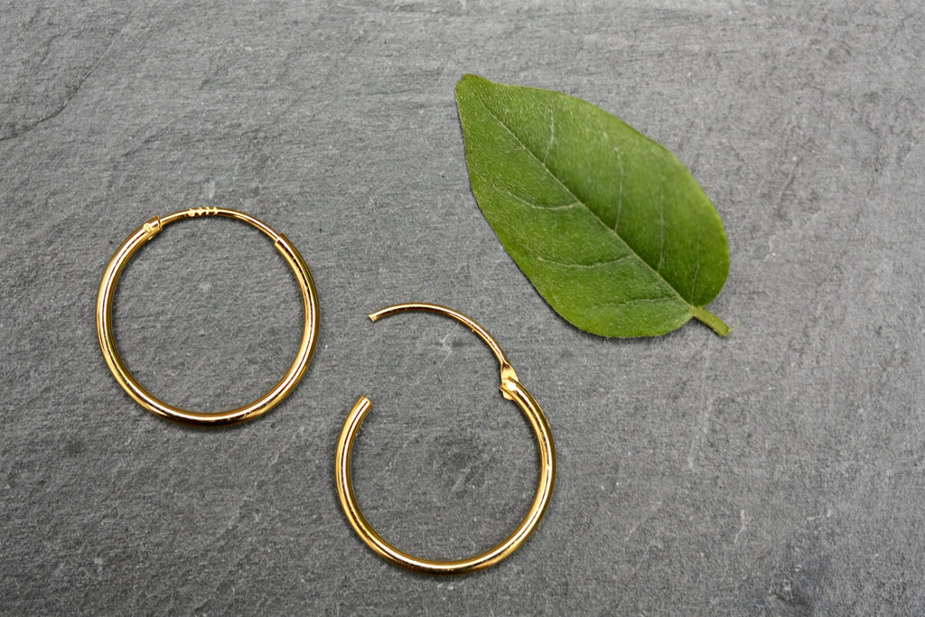 15mm plain sterling silver gold plated hoops.